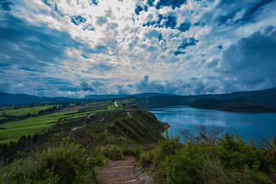 View of lake against cloudy sky