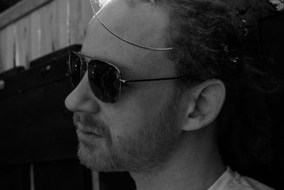 Close-up portrait of man wearing sunglasses