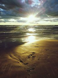 Scenic view of sea against cloudy sky