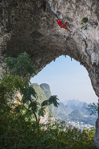 Man climbing on moon hill in yangshuo, a climbing mekka in china