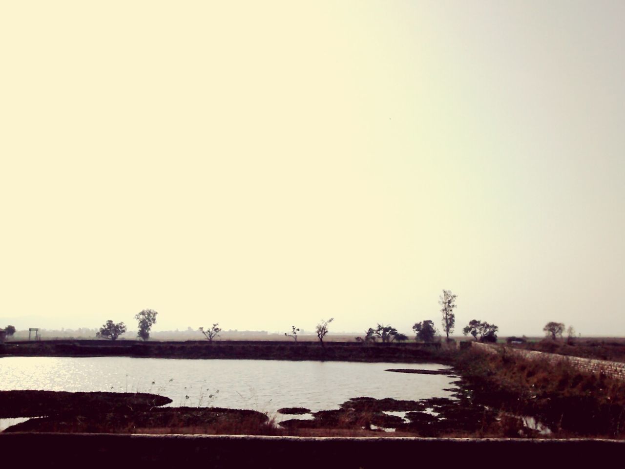 clear sky, copy space, water, built structure, architecture, river, connection, bridge - man made structure, city, bridge, building exterior, waterfront, engineering, outdoors, cityscape, no people, tranquility, transportation, nature, tranquil scene