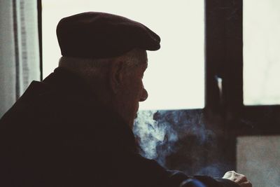 Close-up of senior man at home