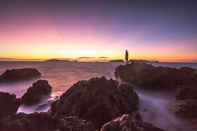 Scenic view of sea at sunset