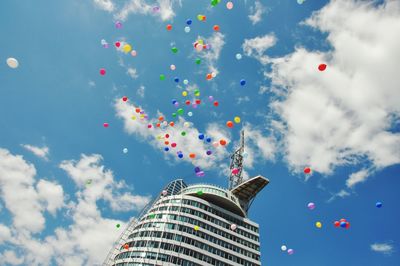 Low angle view of balloons flying in sky