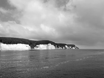 Scenic view of sea against sky during winter