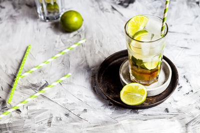 Glass of juice and drink on table