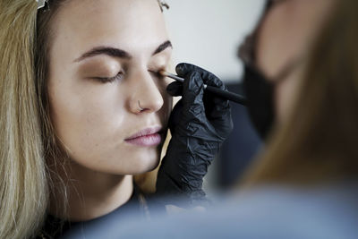 Close-up of young woman looking away