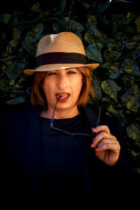 Portrait of smiling young woman in hat