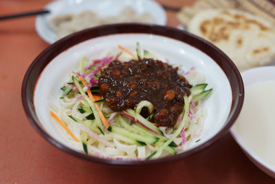 Close-up of food in bowl on red table