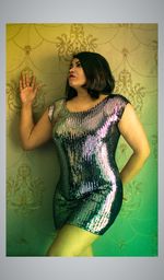 Young woman standing against wall
