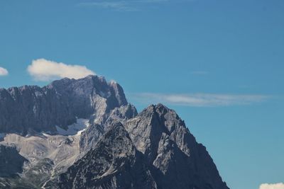 Low angle view of rock formations against sky