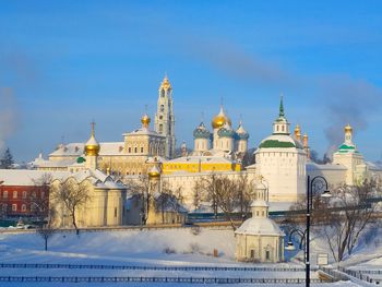 View of buildings against sky during winter