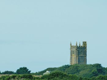 Tower of historic building against clear sky