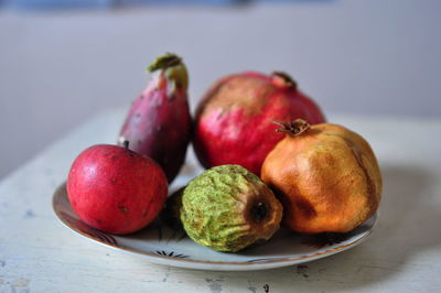 Close-up of fruits in plate on table