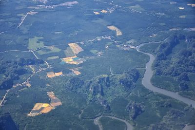 High angle view of airplane flying over land