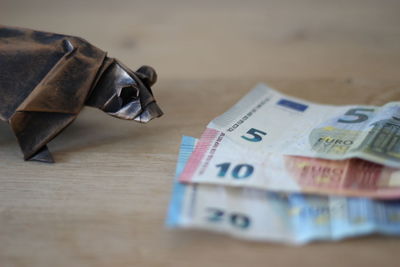 High angle view of coins on table