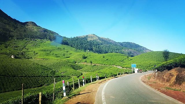 road, mountain, the way forward, transportation, country road, diminishing perspective, mountain range, road marking, blue, clear sky, vanishing point, landscape, tranquility, tranquil scene, empty road, sky, scenics, nature, beauty in nature, long