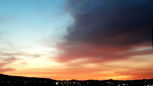 Low angle view of dramatic sky during sunset