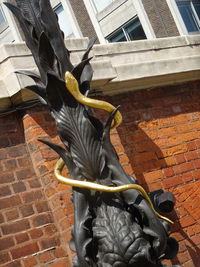 Close-up of statue against window