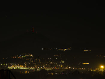 High angle view of illuminated buildings in city at night