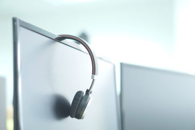 Close-up of computer and headphones