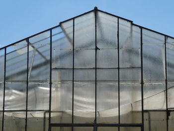 Greenhouse against blue sky