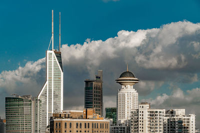 Buildings in city against sky