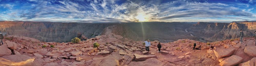 Panoramic view of man on desert against sky