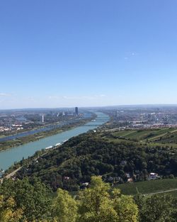 High angle view of city and sea against sky