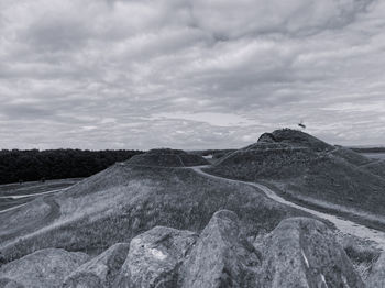 Scenic view of landscape against cloudy sky