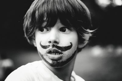 Close-up of boy with face paint