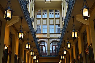 Low angle view of illuminated pendant lights in building