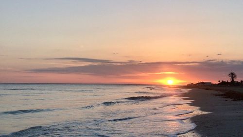 Scenic view of sea against sky during sunset