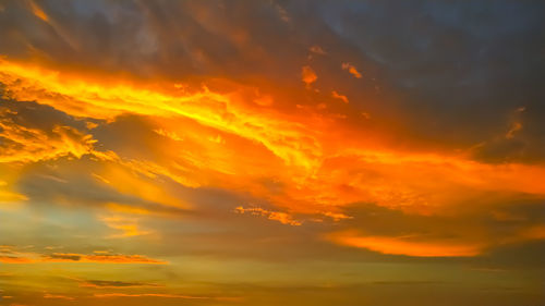 Low angle view of dramatic sky during sunset