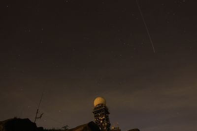 Low angle view of communication tower with satellite dish