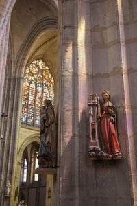 Low angle view of statue against building