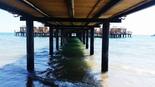 Pier over sea against sky