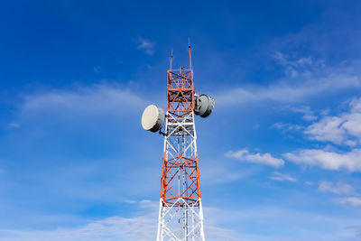 Low angle view of communications tower against sky