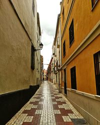 Narrow alley along buildings