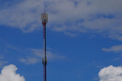 Low angle view of communications tower against sky