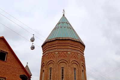 Tholobate of saint george's church with aerial cable cars in the backdrop, old tbilisi, georgia