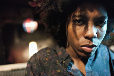 Close-up portrait of young man looking away