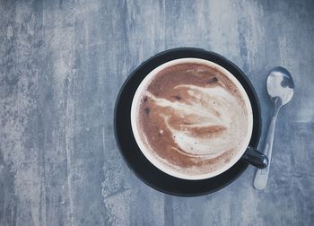 High angle view of cappuccino on table