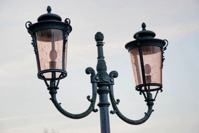 Low angle view of street light against sky