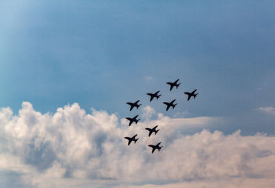 Low angle view of planes flying in sky