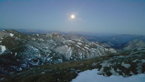 Scenic view of snowcapped mountains against sky during winter