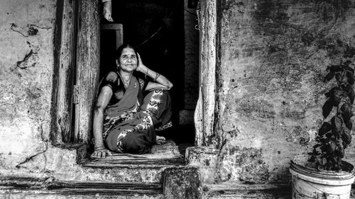 Old statue against abandoned building