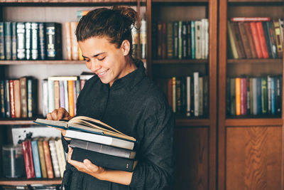 Young woman reading book