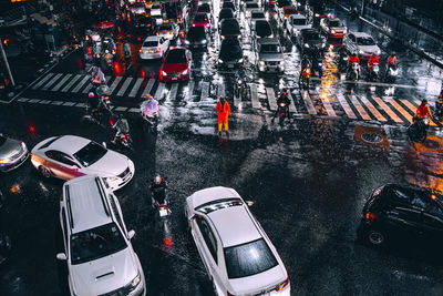 High angle view of traffic on city street during rainy season