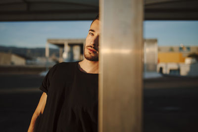 Portrait of young man standing outdoors
